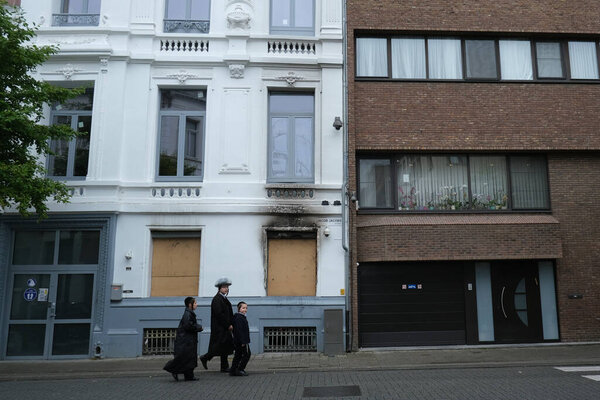 Members of Ultra-Orthodox Jewish community return from the Synagogue after a religion service in Antwerp, Belgium, on Shabbat, July 4, 2020.