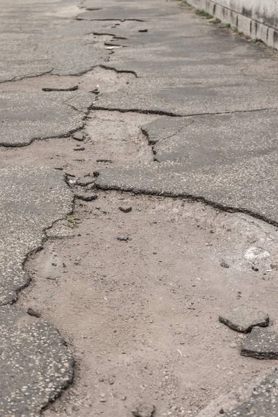 Ailing pothole road requires important infrastructure investment — Stock Photo, Image