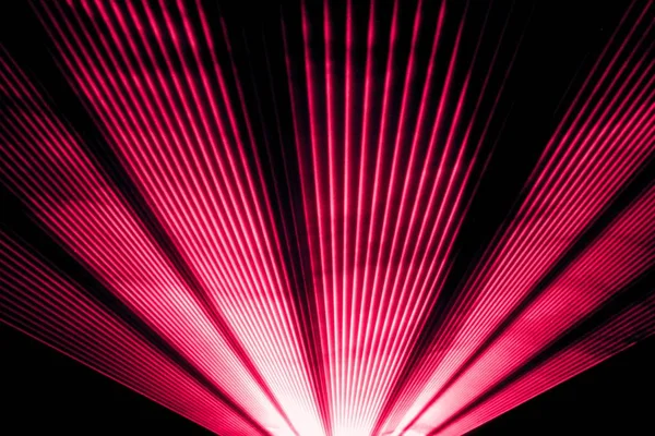 Red laser show nightlife club stage and shining sparkling rays — Stock Photo, Image