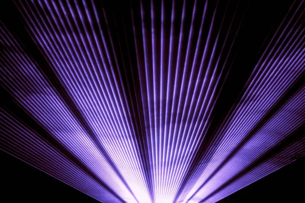 Purple laser show nightlife club stage shining sparkling rays — Stock Photo, Image