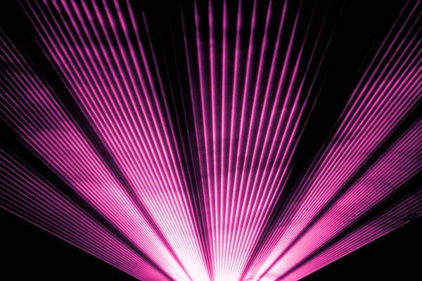 Pink laser show nightlife club stage and shining sparkling rays