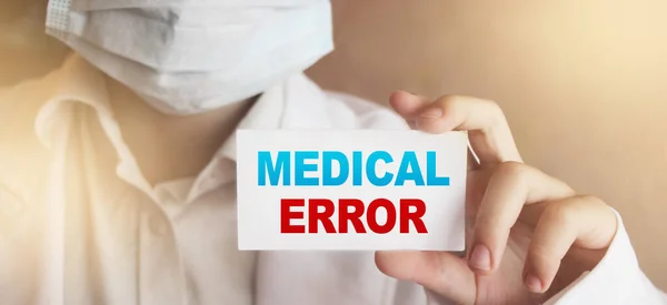 Doctor holding a card with Medical Error, Medical concept.