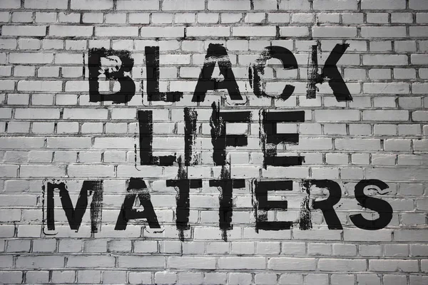 Black live matters Words on brick wall. Stop racism social blm concept.