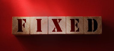 Tahta blokta sabitlenmiş kelime. İş muhasebe finansal konsepti.