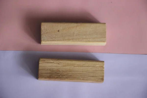 Two wood blocks forming equal sign on soft pink and lilac background. Tolerance, equality and diversity conccept, Male and Female equal pay concept.