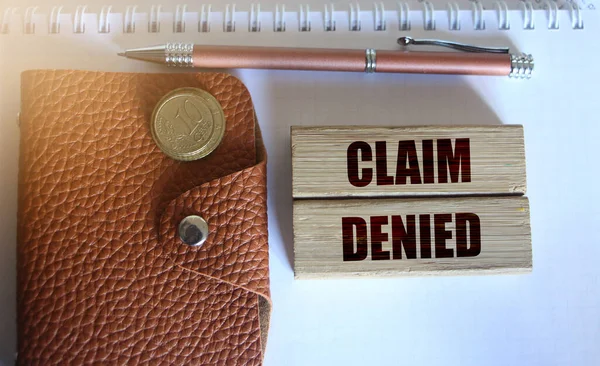 Wooden Blocks Text Claim Denied Brown Leather Wallet Pen Coins — Stock Photo, Image