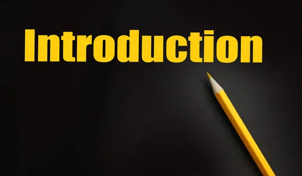Introduction Word and yellow pencil besides. Business concept.