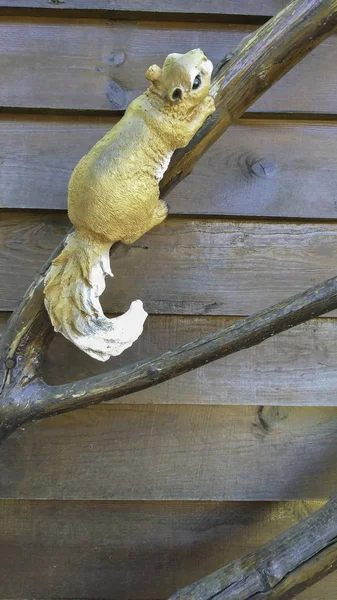 garden figurine, squirrel on a branch