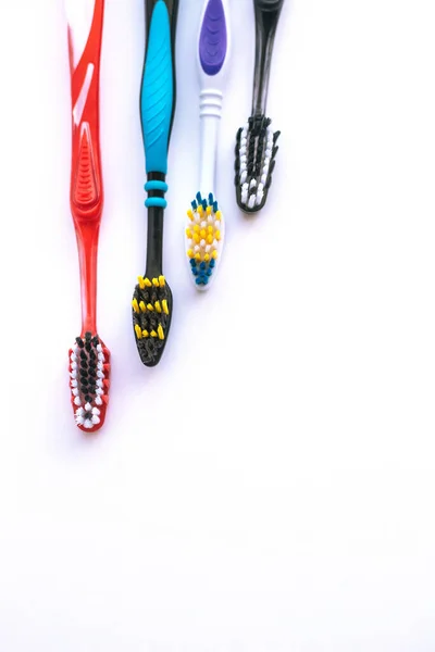 Colored toothbrushes. Oral hygiene. Different brushes. — Stock Photo, Image