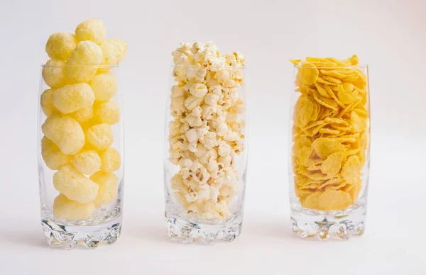 Three Glass Glasses Filled Popcorn Corn Flakes Corn Sticks Light — Stock Photo, Image