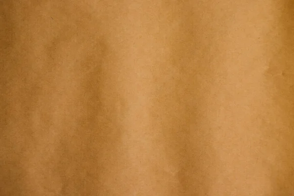 베이지 크래프트 페이퍼의 텍스처. 소포를 포장하기 위한 종이 뒷면. — 스톡 사진
