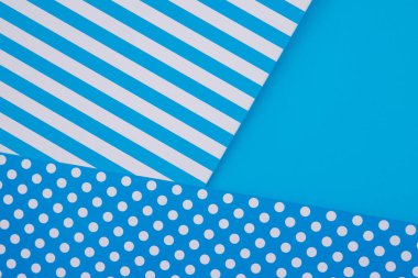 Geometri tarzında modaya uygun kağıtların doku arka planı. Mavi arkaplandaki kağıt.