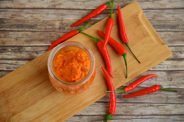 Sambal A popular Indonesian condiment of red chili peppers in a jar. Flat lay