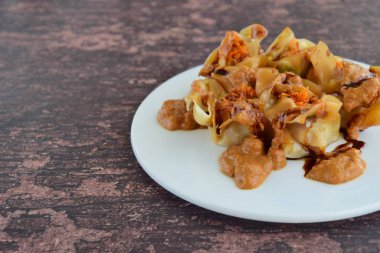 Siomay, Indonesian Food, steamed dumplings with peanut sauce and thick soy sauce or kecap manis