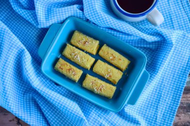 Kastengel or Kue Keju or Dutch Indonesian cheese stick cookies, served with coffee