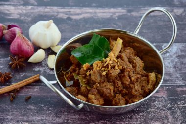 Rendang padang, beef meat cooked in coconut milk and spices, Indonesian food  clipart