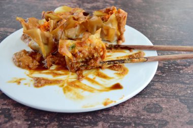 Siomay, Indonesian Food, steamed dumplings with peanut sauce and thick soy sauce or kecap manis