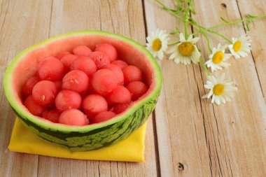 fruit salad of watermelon balls in a watermelon skin bowl
