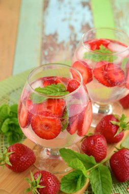 Strawberry refreshing summer drink in glasses garnish with mint leaves
