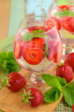 Strawberry refreshing summer drink in glasses garnish with mint leaves
