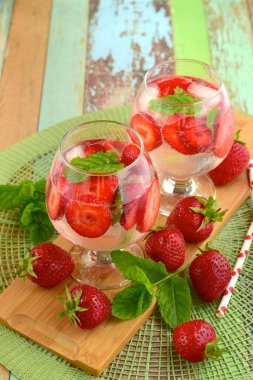Strawberry refreshing summer drink in glasses garnish with mint leaves
