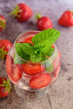 Strawberry refreshing summer drink in glasses garnish with mint leaves
