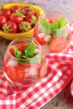 Strawberry refreshing summer drink in glasses garnish with mint leaves