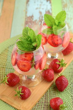 Strawberry refreshing summer drink in glasses garnish with mint leaves