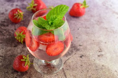 Strawberry refreshing summer drink in glasses garnish with mint leaves