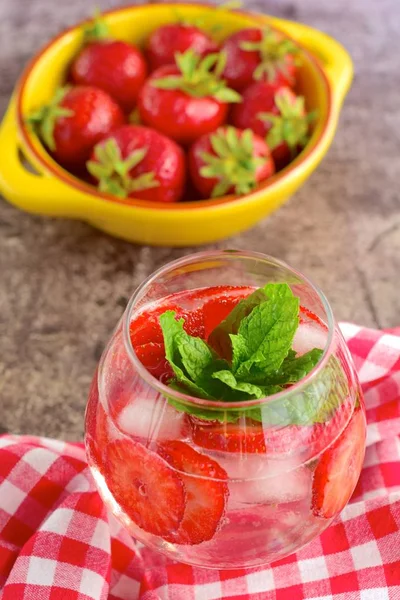 Strawberry refreshing summer drink in glasses garnish with mint leaves