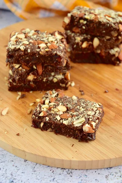 Fudge Brownies Dark Chocolate Cake Topping Almond Nuts Wooden Board — Stockfoto