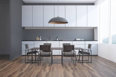 Gri sandalyeleri beyaz mutfak tezgahı ayakta uzun bir tabloyla ile gri yemek odası inteiror. 3D render alay