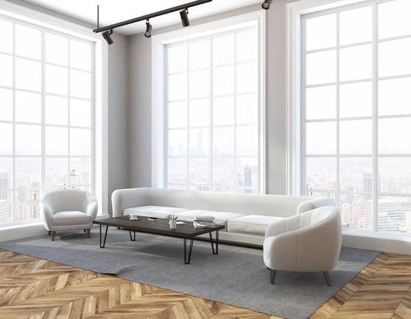 Loft living room interior with gray walls, a wooden floor, a long white sofa and two armchairs near a coffee table. A side view. 3d rendering mock up