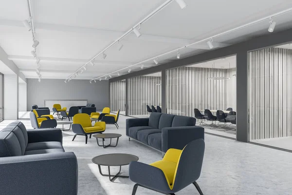 Corridor of a luxury office with dark gray and white plank walls, a concrete floor and yellow and gray armchairs standing next to gray sofas. A side view. 3d rendering