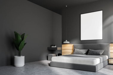 Bir beton zemin, bir king size Yataklı ve bunun üzerinde asılı bir çerçeve dikey poster ile koyu gri yatak odası iç. 3D render alay