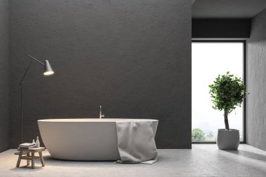 Beyaz bir küvet Bu minimalist bir siyah banyo bir beton zemin üzerinde duran asılı bir havlu ile kapatın. Bir ağaç ve bir lamba. 3D render alay