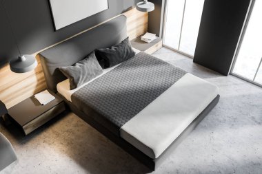 Üstten görünüm gri yatak köşesinde bir beton zemin, bir king size Yataklı ve bunun üzerinde asılı bir çerçeve dikey poster. 3D render alay