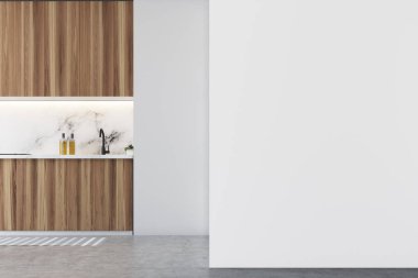 Beyaz mutfak iç gri mutfak tezgahı, yuvarlak ahşap masa ve sandalyeler duruyor. Yukarıda asılı tavan lambası. Boş bir duvar. 3D render alay