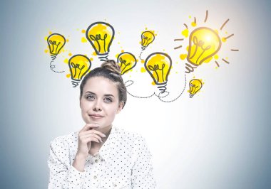 Bir beyaz noktalı gömlek giymiş ve elinde çene ile oturan genç bir kadın portresi. Çok uzakta ve hayal görünüyor. Birçok fikir