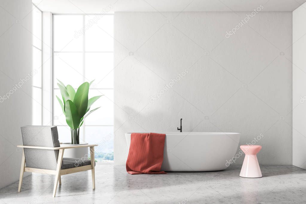 White bathtub with a red towel hanging on it standing in a modern bathroom interior with white walls and an armchair. 3d rendering mock up