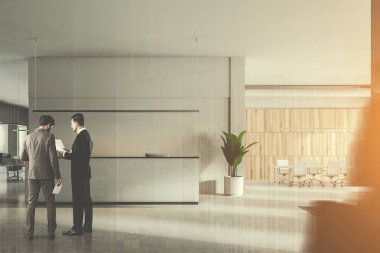 Modern bir ofis bir beton zemin üzerinde beyaz resepsiyon masası ayakta önden görünümü. Arka plan bir konferans odasında. İşadamları bahsediyoruz. 3D render sahte tonlu görüntü çift pozlama kadar bulanık