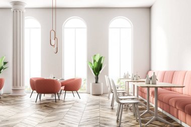 Yanında duran pembe koltuklar ile yuvarlak masa. Büyük pencereler ve sütunlar. Pembe kanepeler ile modern kahve dükkanı iç. 3D render