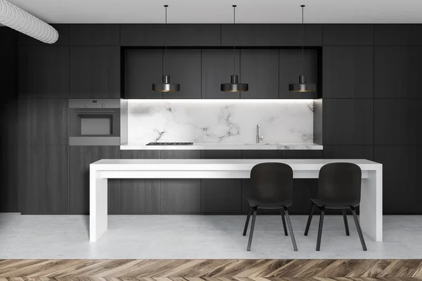 Black and marble kitchen interior with black countertops with built in appliances and a white narrow table with chairs. 3d rendering mock up