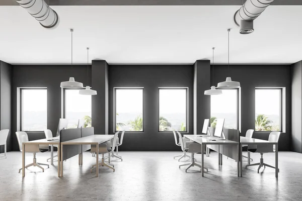 Dark gray industrial style office interior with a white floor, loft windows, simple white tables and chairs. Computers on desks. A side view. 3d rendering mock up