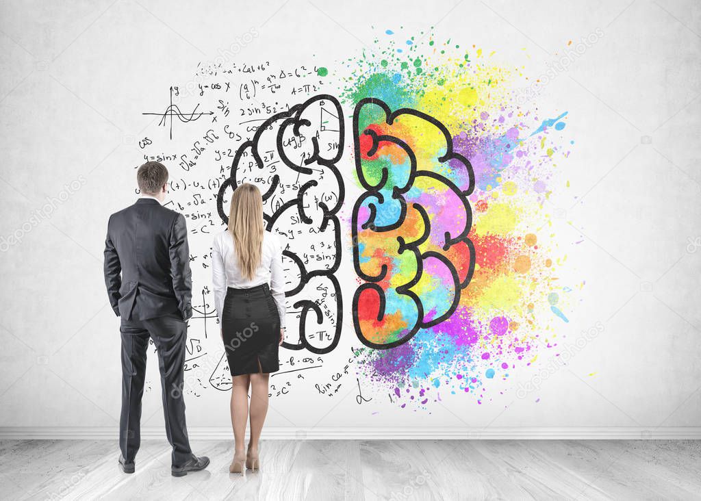 Rear view of young and successful business partners wearing suits looking at a concrete wall with a colorful brain sketch, formula and color splashes. Creativity in business concept