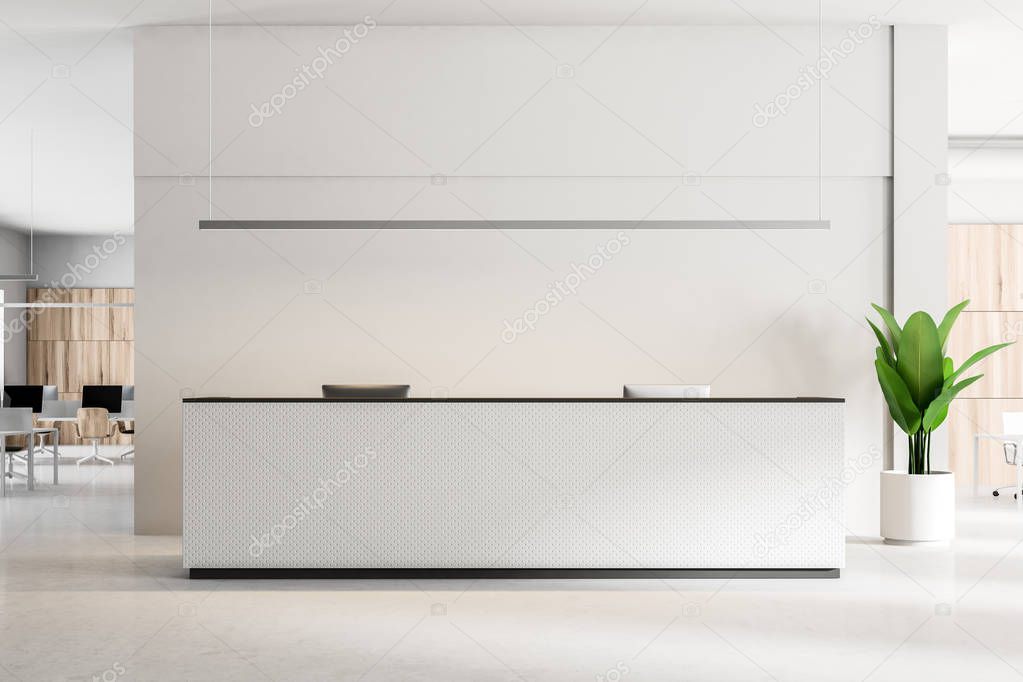 White reception desk with computers standing on a concrete floor of a modern office. An open space office area in the background. 3d rendering mock up