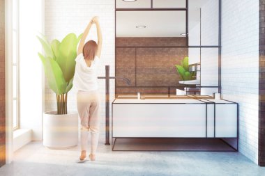 Beyaz bir beyaz tuğla loft banyo iç beyaz bir zemin ve Saksı bitki içinde lavabo. Büyük bir ayna. Bir kadın. 3D render sahte tonlu görüntü