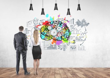 Rear view of young and successful business partners wearing suits looking at a colorful cog brain icon and a business scheme drawn around it on a concrete wall. clipart