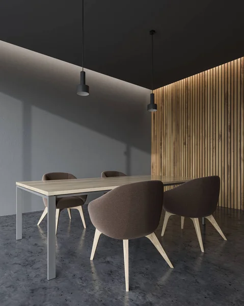 Wooden and grey wall office conference room corner with a concrete floor, a king size table and brown chairs. A mock up wall 3d rendering