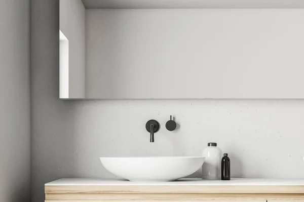 White saucer like bathroom sink standing on a wooden countertop of a Scandinavian style bathroom interior with a large horizontal mirror hanging above it. 3d rendering — Stock Image White Saucer Bathroom Sink Standing Wooden Countertop Scandinavian Style Bathroom Royalty Free Stock Photos